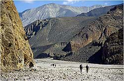 Trekkers head up the Kali Ghandaki river bed towards Kagbeni. This is the start of the trek to Lo Manthang,